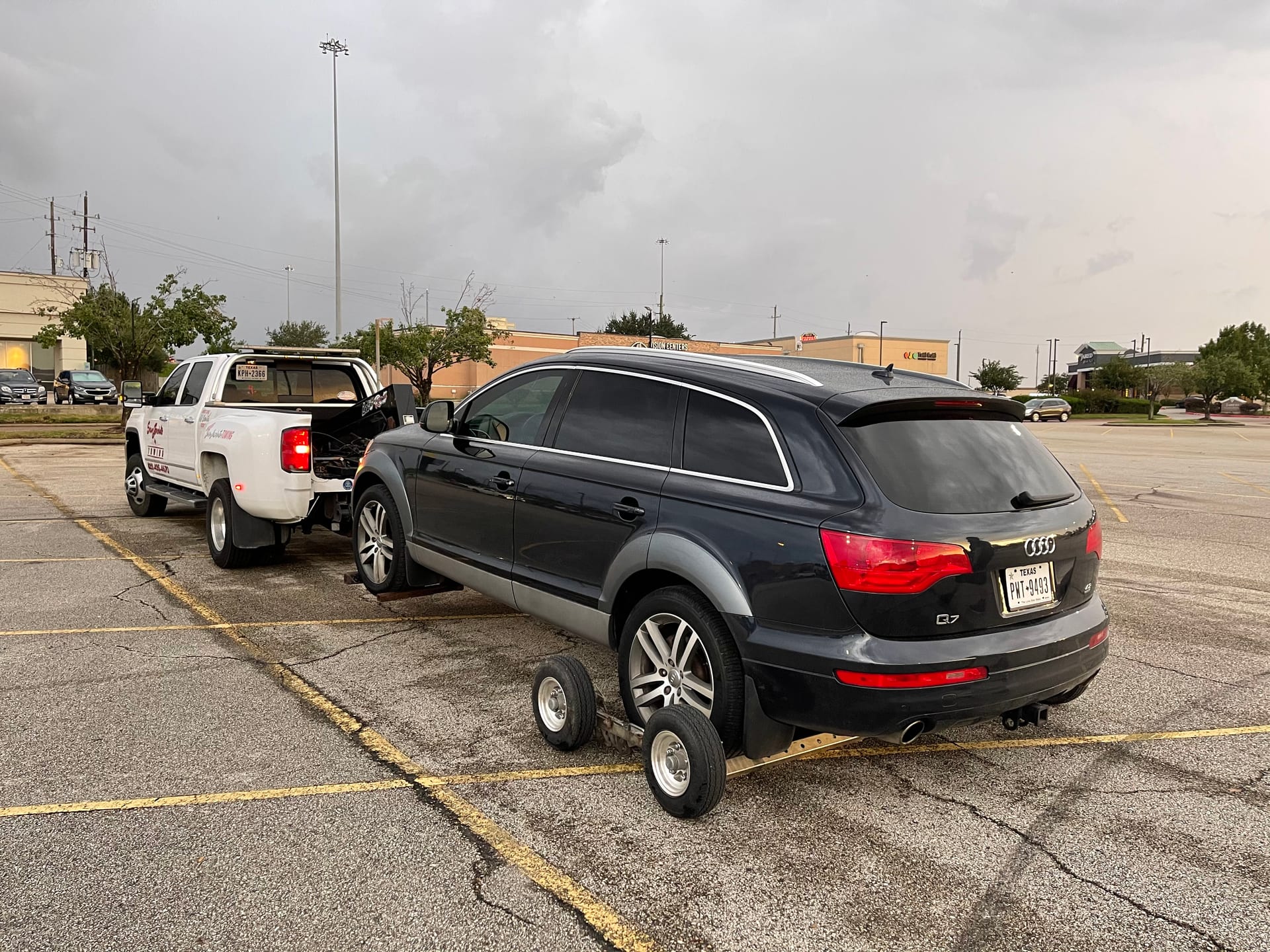 Audi Q7 being wheel-lifted — light duty towing Crosby TX