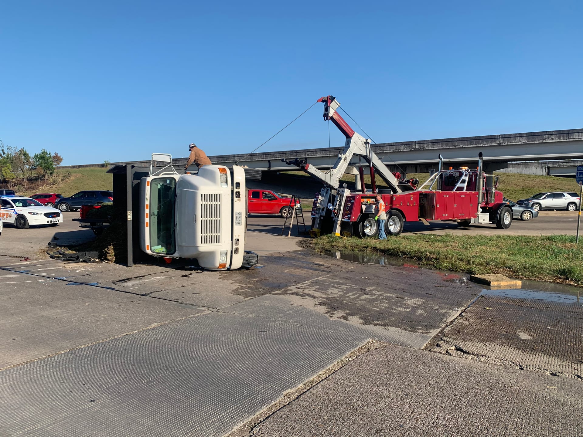 Smith Towing recovering a box truck on a freeway overpass near Channelview, TX