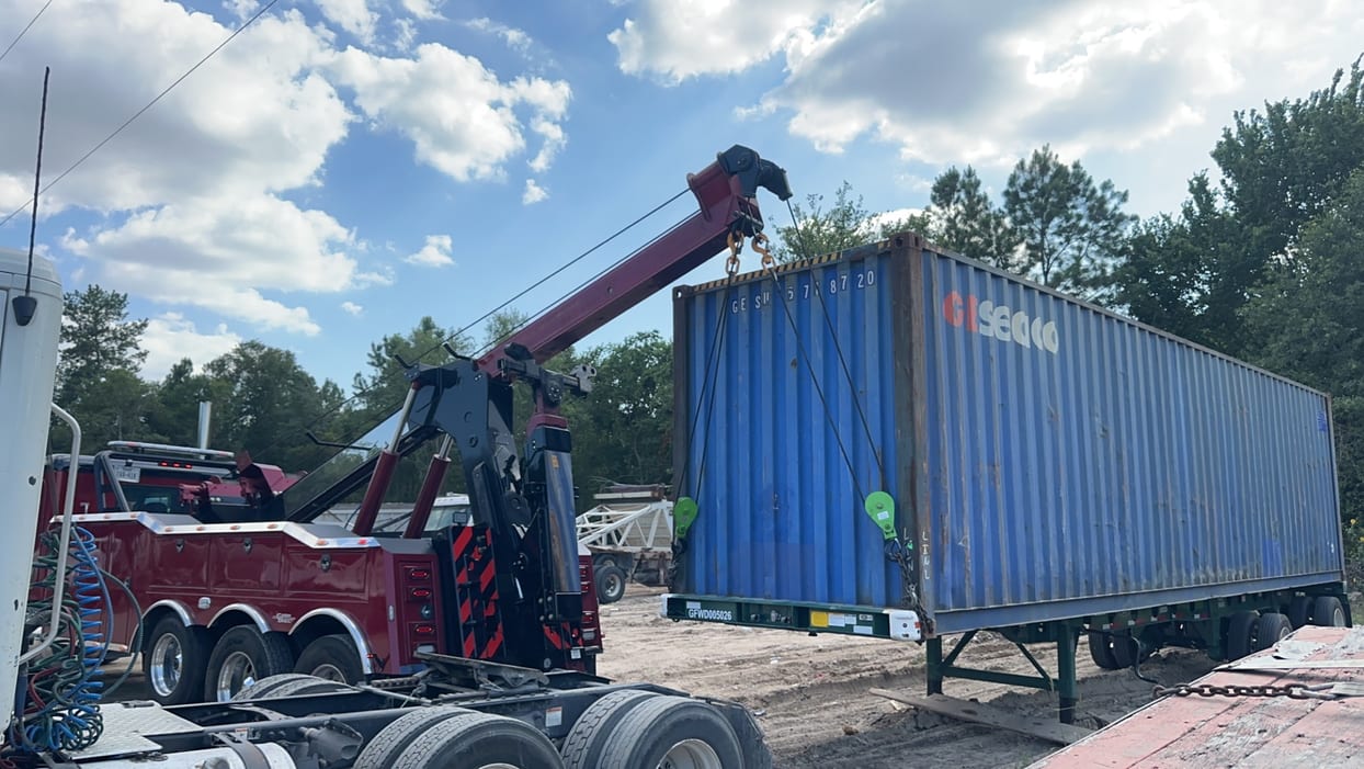 Container lift by rotator