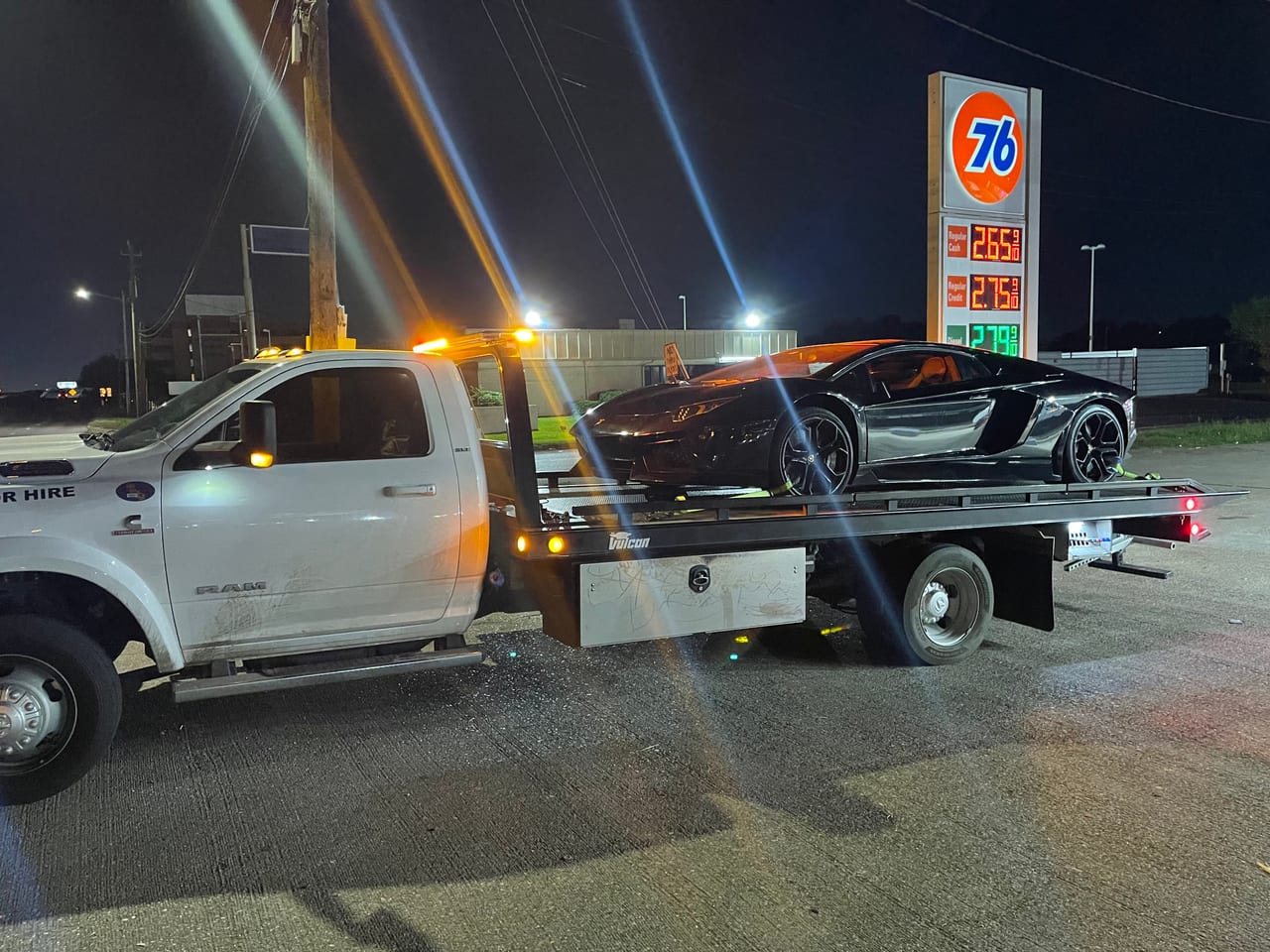 Lamborghini on flatbed at night