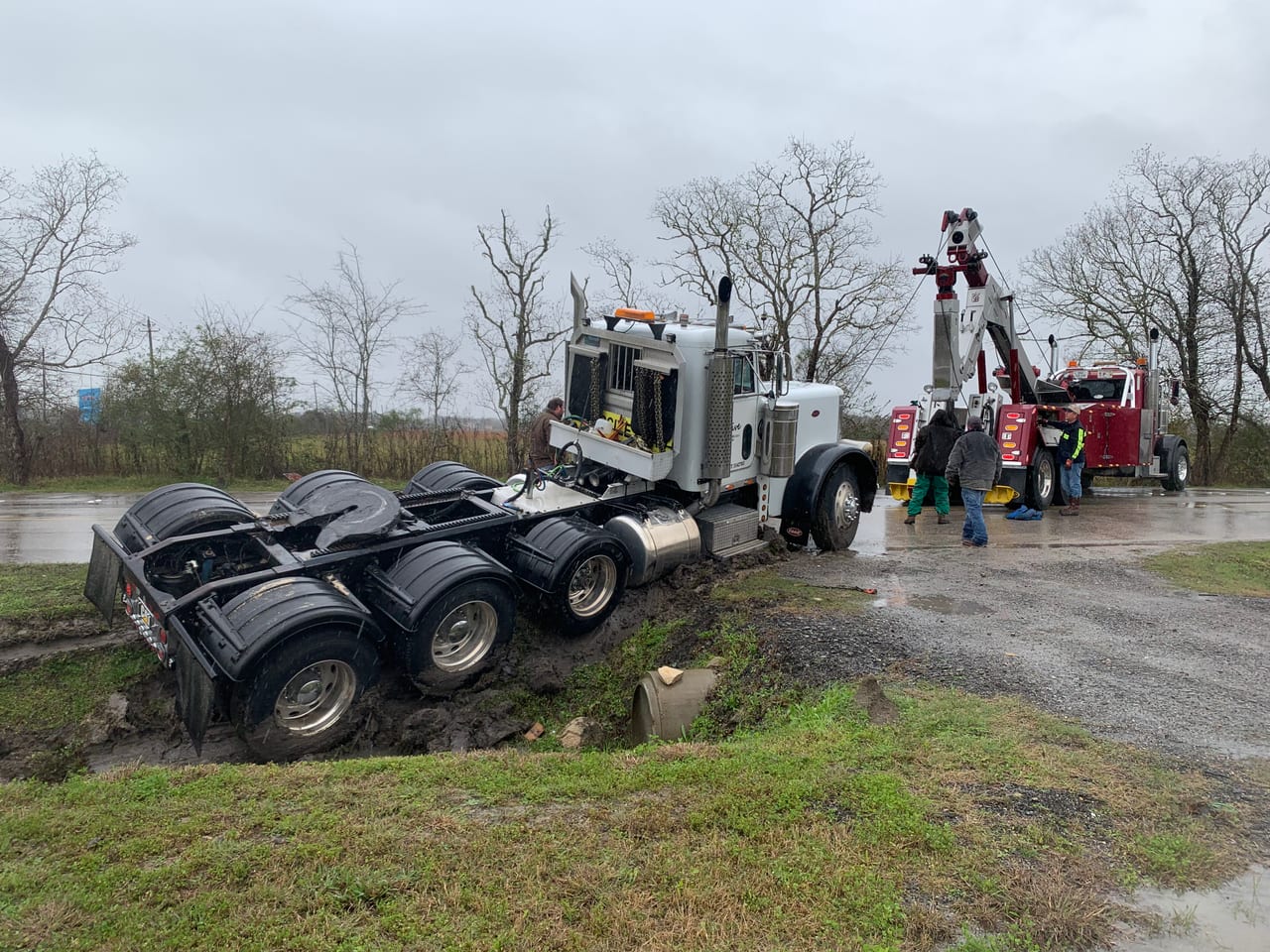 Peterbilt rotator recovering heavy truck