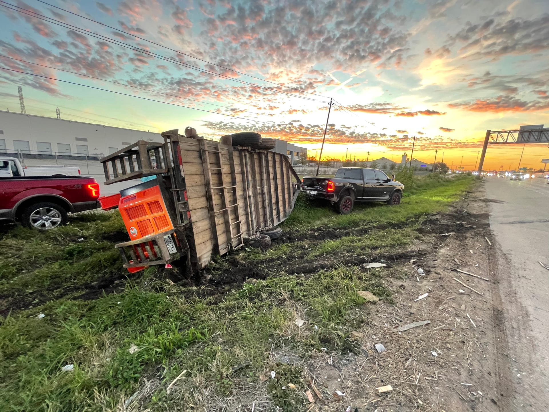 Overturned school bus at sunset on the interstate — bus towing recovery